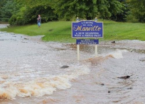 Flood at the Welcome to Manville Sign